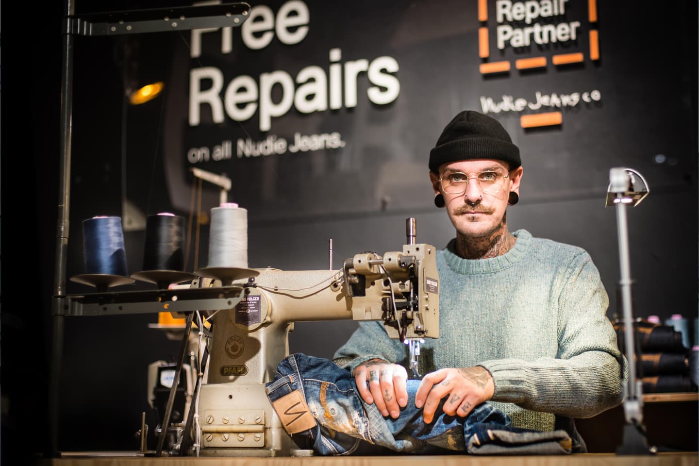 Illustration for the article "Nudie Jeans Free Repair Program: Who Qualifies, Where You Can Go, and the Limits — According to the Brand's Own Help Center" from Nudie Jeans